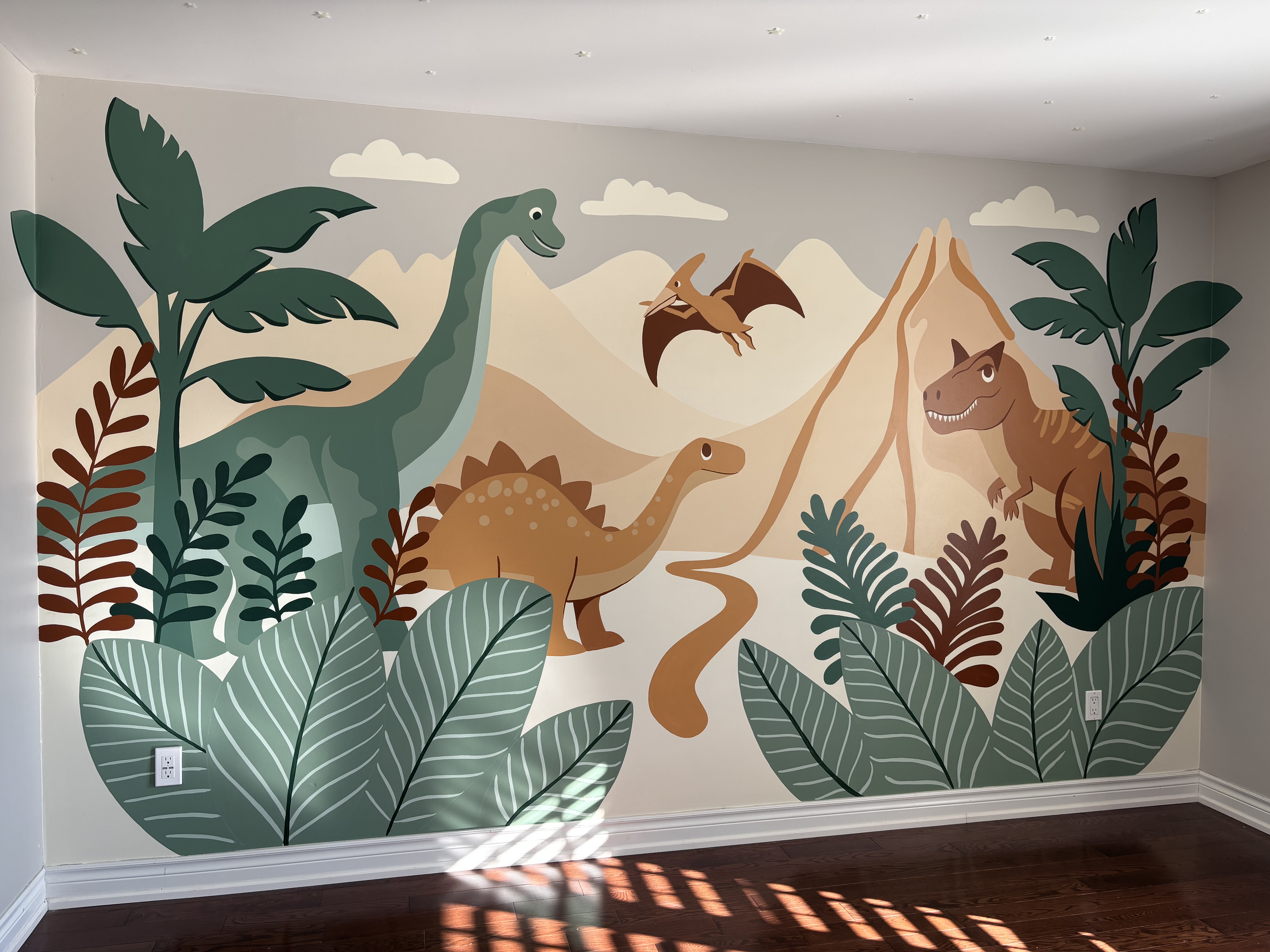 Hand-painted dinosaur mural boys bedroom in soft neutral tones creating a calm kids room